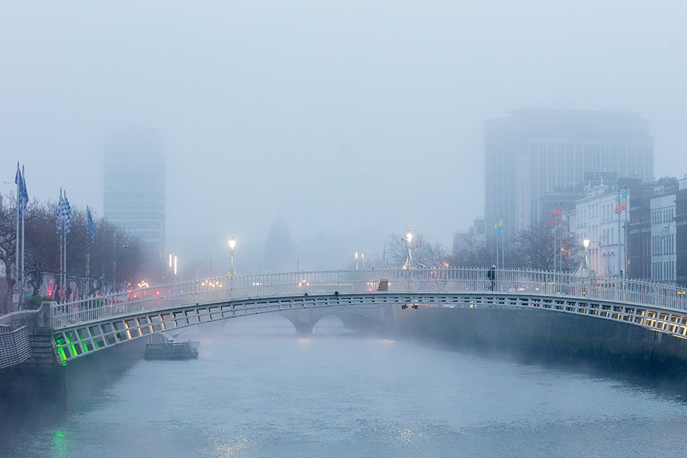 The Hapenny bridge in Dublin on a foggy day